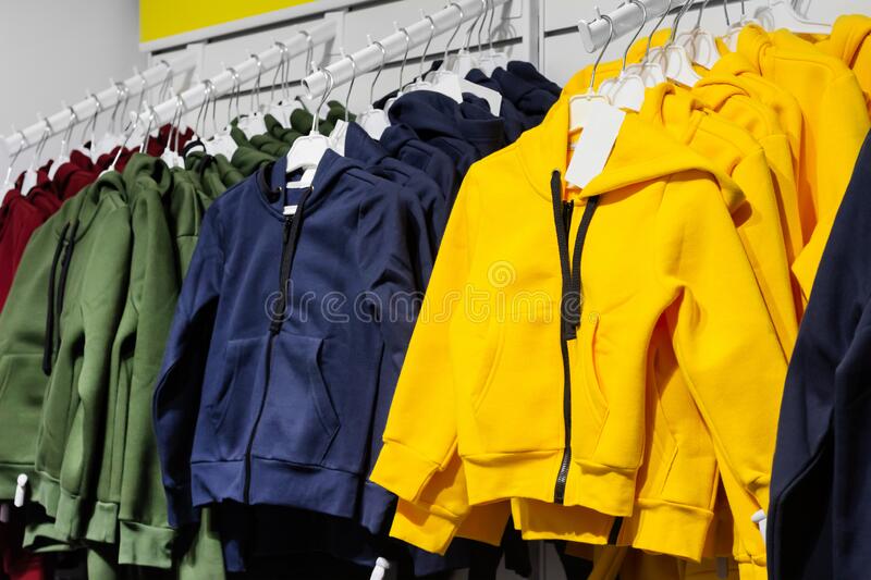 child-store-jackets-hoodies-hanging-rack-photo-teenage-handing-219863223